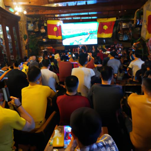 Nhóm CĐV cực kỳ tập trung xem trận đấu bóng đá trên màn hình TV lớn tại quán cafe xem bóng đá.