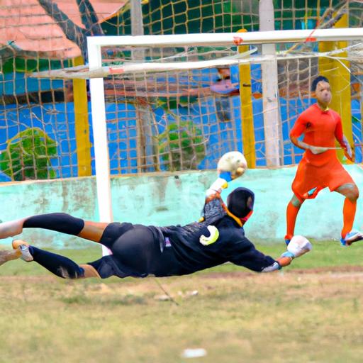 Thủ môn bóng đá Việt Nam lao để cản phá cú sút của đội đối thủ